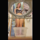 A very pretty girl wearing glasses sits on a potty chair while shitting into a plastic container below. She wipes her ass with panties, shows us the dirty panties, then shows us the full container when finished. Vertical format video. About 3 minutes.